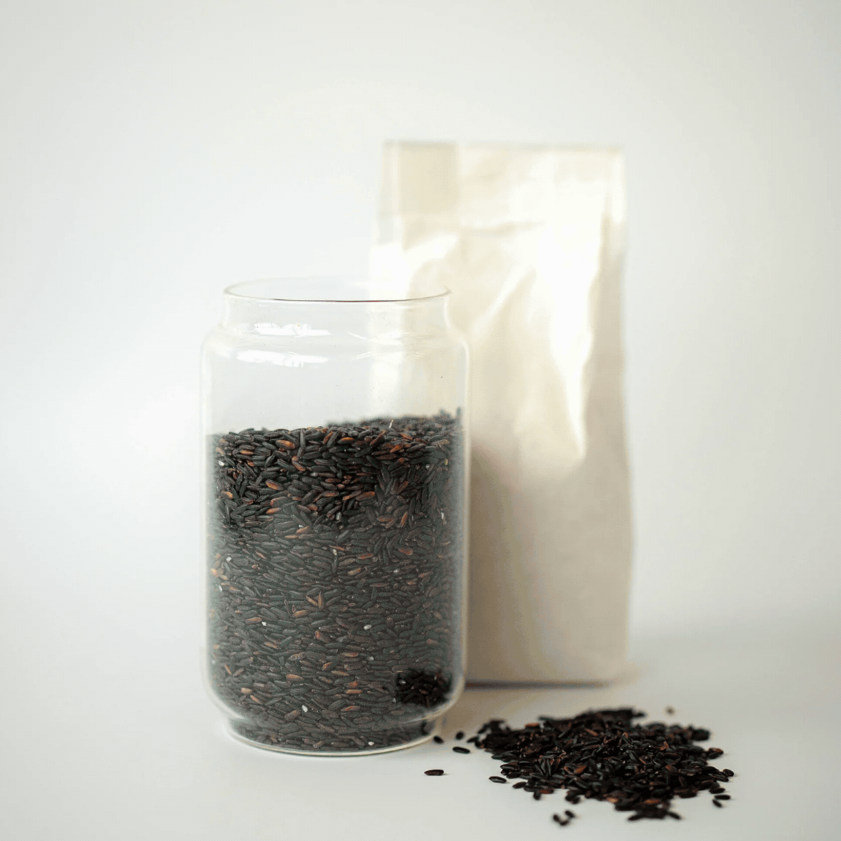 Glass jars filled with loose pantry ingredients.